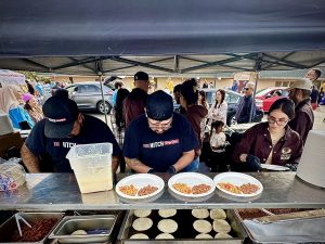 Volunteers preparing food for the Heal Dena Fire Relief effort